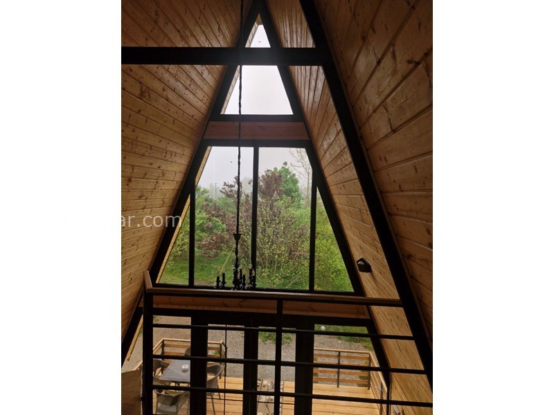 عکس شماره 852703 - اجاره کلبه چوبی در رضوانشهر گیلان - منظرهٔ باغ از اتاق خواب کلبه